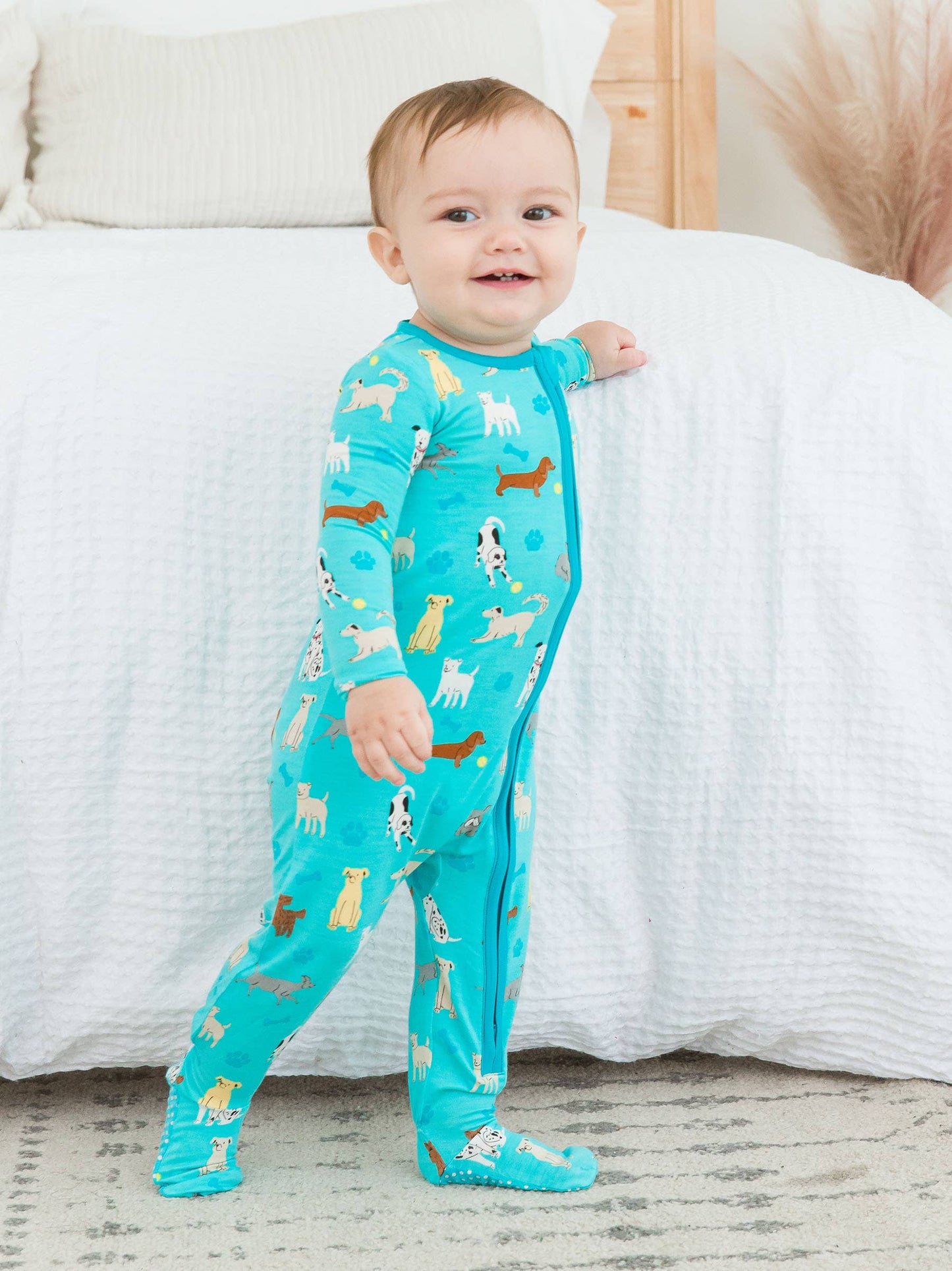 RuffleButts + RuggedButts - Baby Boys Bamboo Viscose Puppy Playtime Footed Pajama: Blue / 18-24m